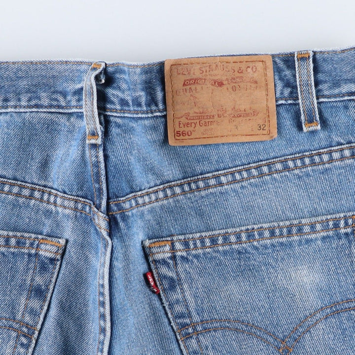 00'S Levi's 560 LOOSE FIT TAPERED LEG tapered denim pants made in the USA, men's size w34 cotton blue type Vintage Second Hand