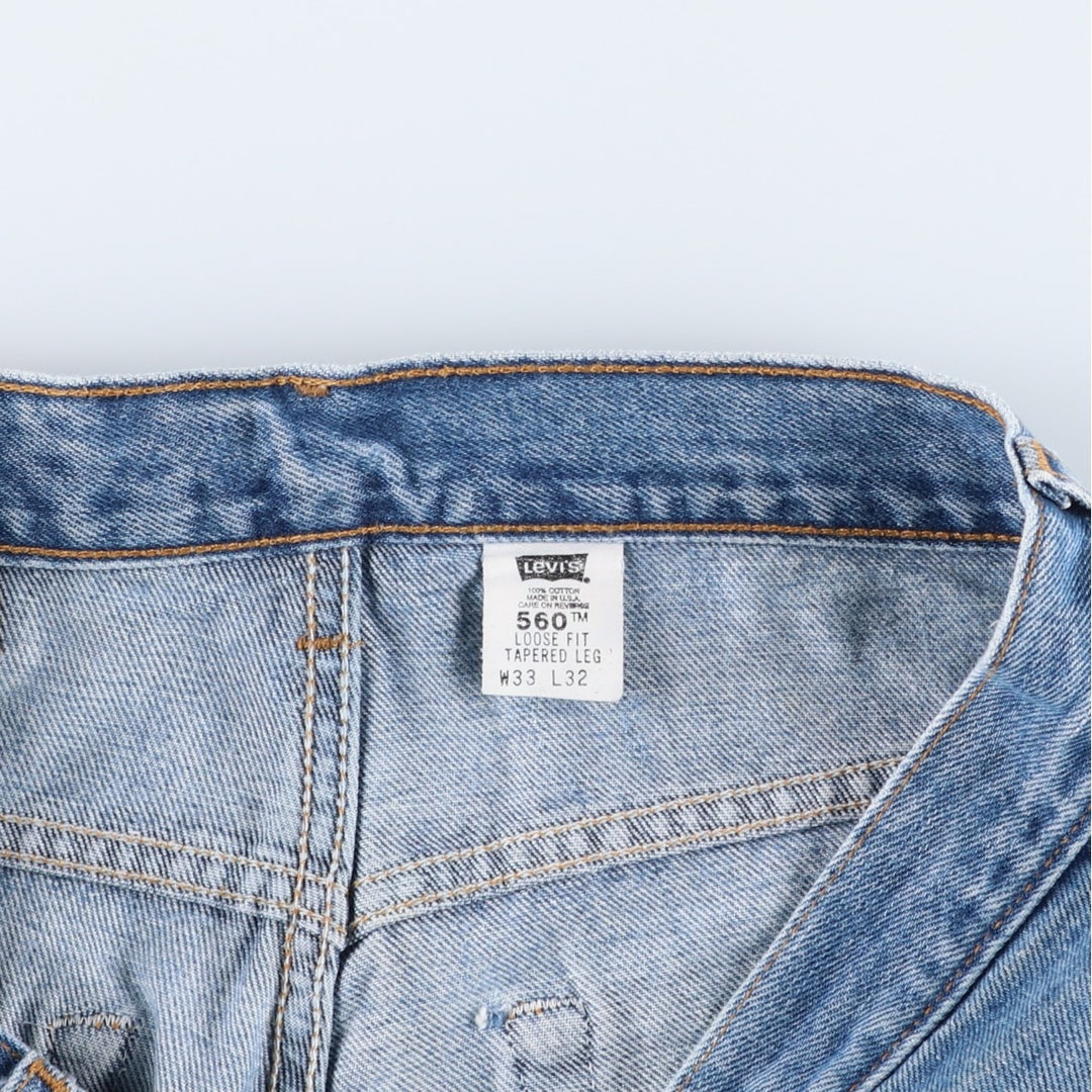 00'S Levi's 560 LOOSE FIT TAPERED LEG tapered denim pants made in the USA, men's size w34 cotton blue type Vintage Second Hand