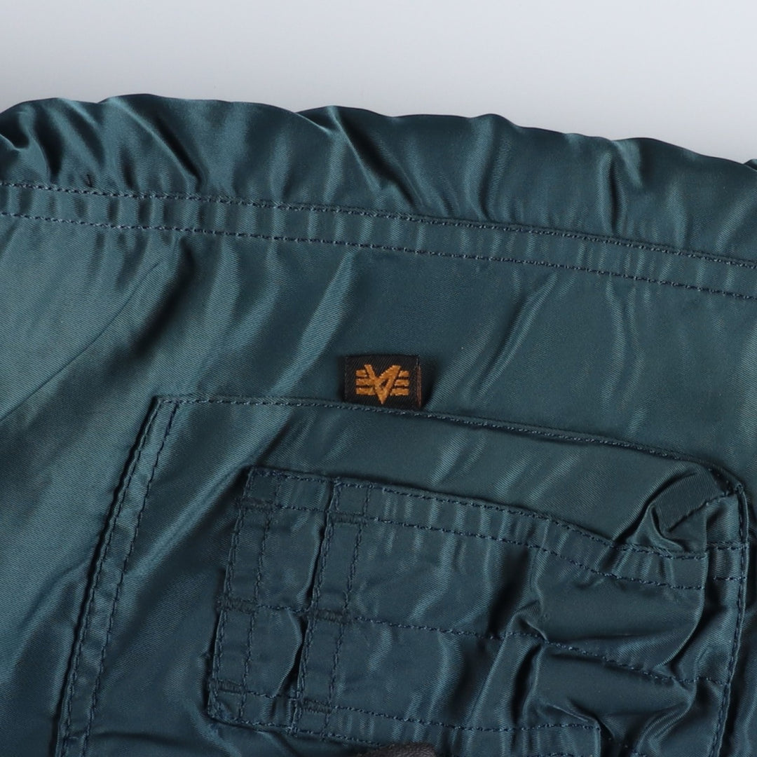 Civilian-grade Alpha Industries N-2B type padded military flight jacket, men's size M equivalent. Nylon blue type Vintage Second Hand