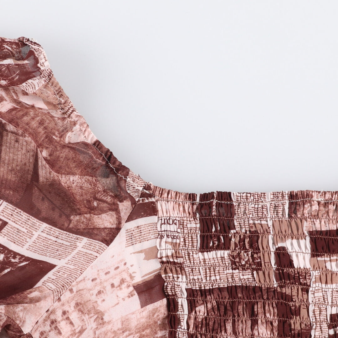 All-over print cropped top with a heart neck and candy sleeves. See-through long sleeves. Women's size S. unclear brown type Vintage Second Hand