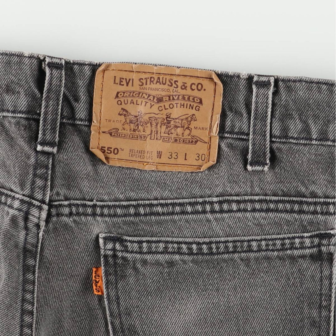 Levi's 550 Relaxed Fit Tapered Leg Men's Tapered Denim Pants with Orange Tabs and Black Denim, Size W33 unclear black type Vintage Second Hand