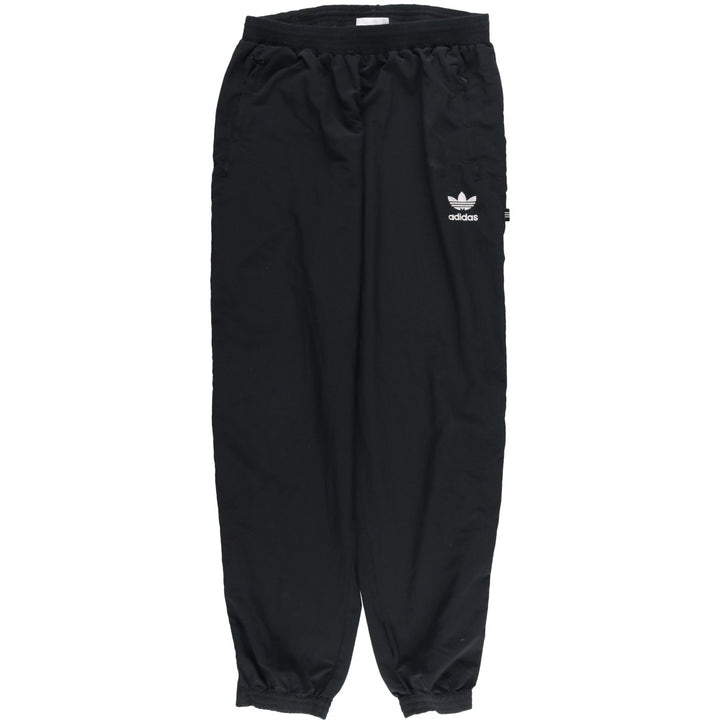 Vintage 1980'S Adidas warm-up pants, nylon, crinkly pants, men's size M. polyester black type Vintage Second Hand