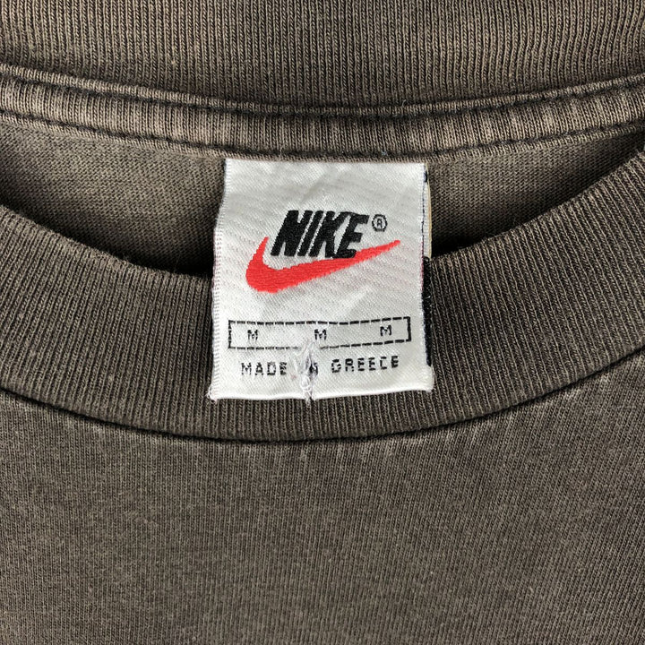 90'S Nike T-shirt with back logo print, men's size M equivalent, vintage. cotton brown type Vintage Second Hand