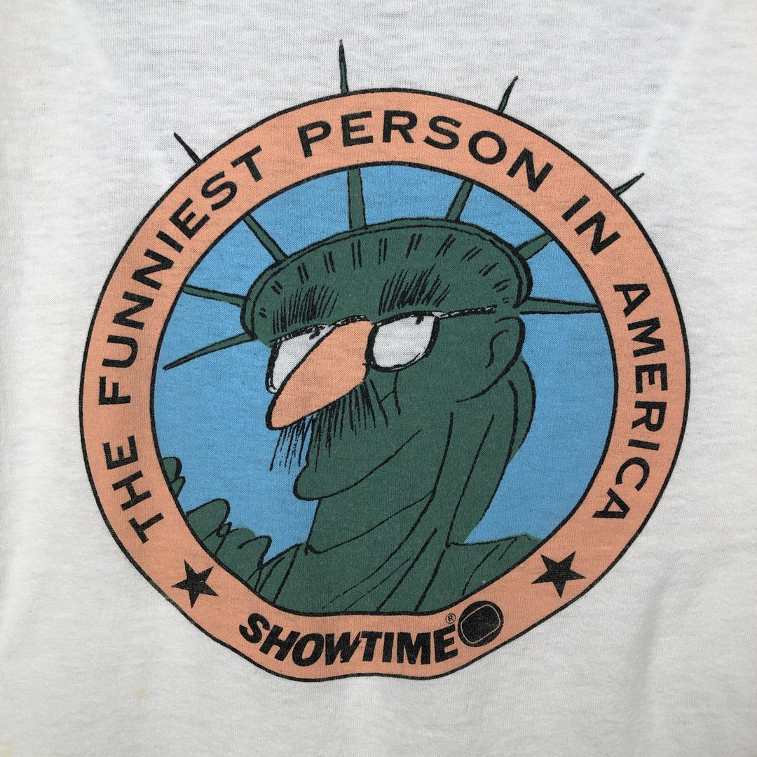 80'S CALIFORNIA GOLD THE FUNNIEST PERSON IN AMERICA Print T-Shirt, Made in USA, Men's XL equivalent, Vintage polyester white type Vintage Second Hand
