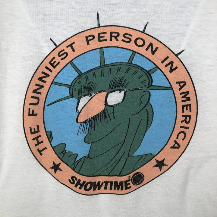 80'S CALIFORNIA GOLD THE FUNNIEST PERSON IN AMERICA Print T-Shirt, Made in USA, Men's XL equivalent, Vintage polyester white type Vintage Second Hand