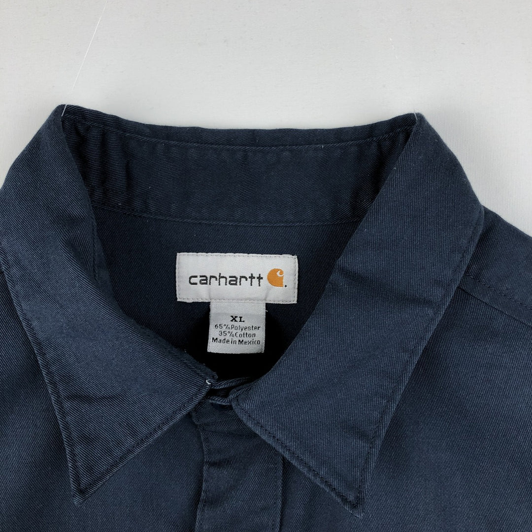 Carhartt back print short-sleeved work shirt, boxy style, men's size XL. polyester navy blue type Vintage Second Hand