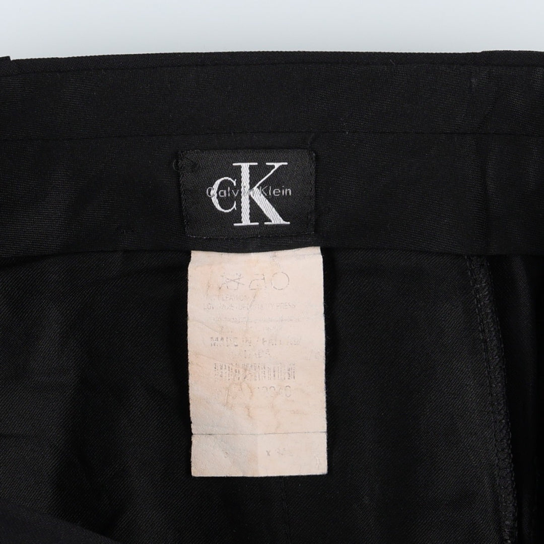Calvin Klein one-tuck slacks, made in the USA, men's size W34 (approx.). unclear black type Vintage Second Hand